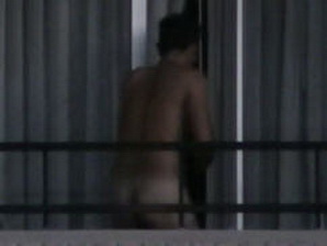The spycam guy only caught a glimpse of another naked guy on the balcony, but still hot.