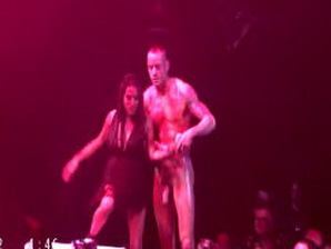 A hot str8 stripper shows off his huge cock on stage at a porn expo!