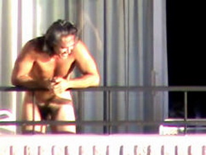 Another naked guy spotted on the balcony by the spycam.